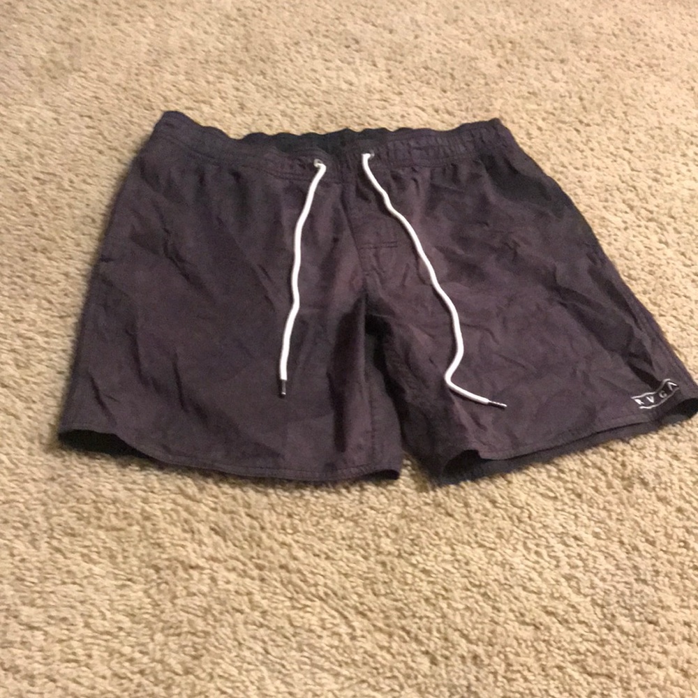 Black RVCA swim trunks.